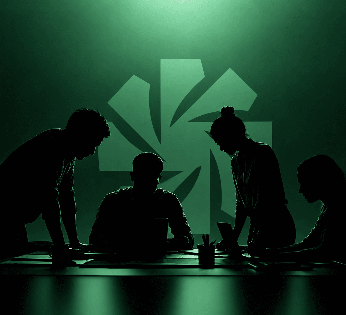 Silhouettes of four people working around a table in front of a green wall carrying the SOL mark.
